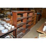 A set of stained pine open fronted bookshelves