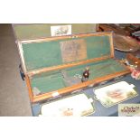 A vintage leather mounted and light oak gun case b