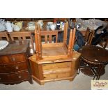 A modern pine corner television cabinet and a nest