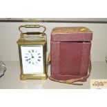 A brass cased carriage clock with carrying case