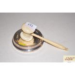 A turned ivory gavel and a circular silver mounted