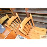 A pair of modern pine stick back kitchen chairs; a