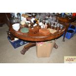 A 19th Century circular rosewood snap top dining t