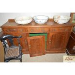 A Victorian golden oak sideboard