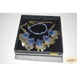 A white metal and blue hardstone set necklace and