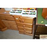 A pine bedside chest fitted four drawers