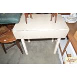 A Formica top drop leaf table