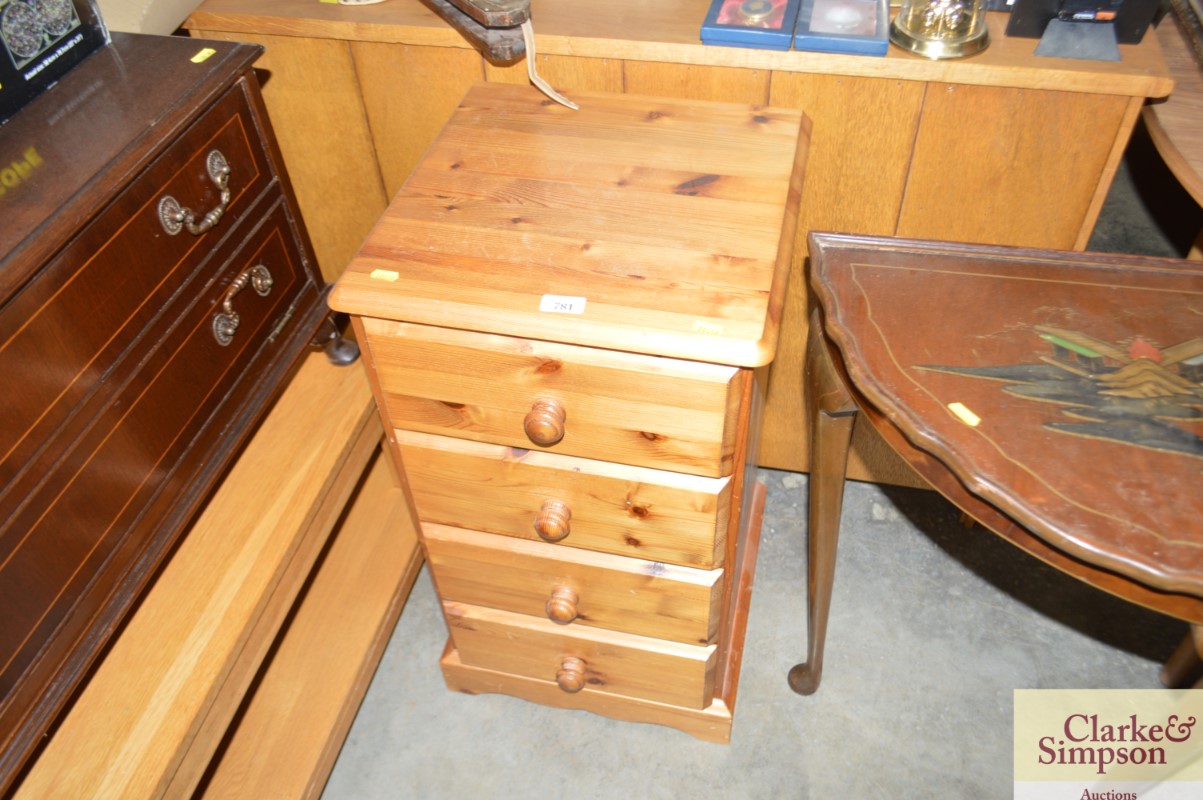 A pine bedside chest fitted four drawers