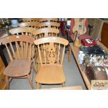 A set of four beech dining chairs