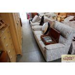 A floral upholstered four piece suite comprising o