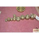 Nine brass cylindrical shaped weights, 1oz - 8oz