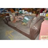 A modern leather upholstered three seater settee a