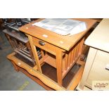 A light oak bedside table fitted single drawer