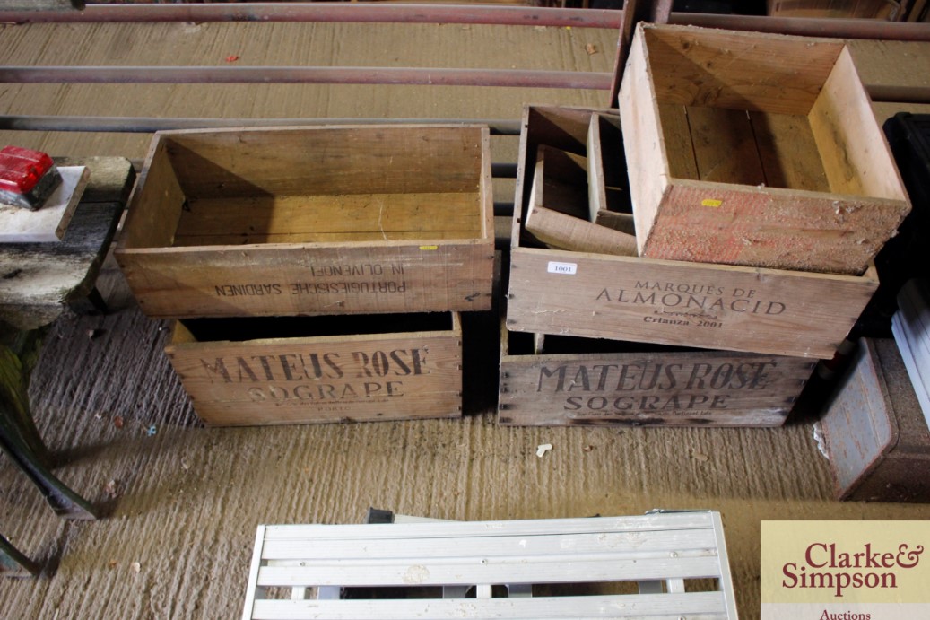 A quantity of wooden advertising crates