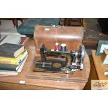 A Hibernia hand sewing machine in fitted case