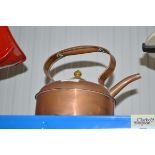 An antique copper kettle