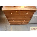 A modern pine chest fitted two short over three lo