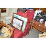 A pair of red upholstered chairs