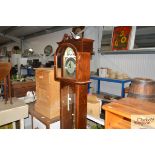 A Tempeist Fugit Wood & Sons 31day long case clock