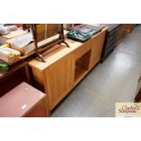 A light oak sideboard fitted single drawer with in