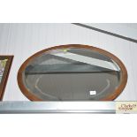 An oak framed bevel edge wall mirror