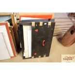 A bundle of various artists materials and canvases