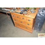 A modern pine multi drawer chest
