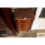 A reproduction mahogany bow front chest fitted fou