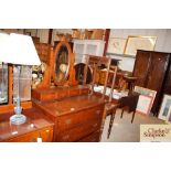 An oak dressing chest fitted three long drawers