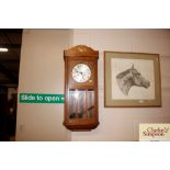 A 1920's oak wall clock