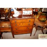 An oak chest fitted four long drawers