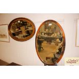 Two oval bevel edged wall mirrors