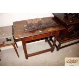 An oak side table fitted single drawer