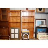 A pair of stripped pine open fronted bookcases