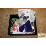 A box containing Beatrix Potter 50p, Bobby Robson