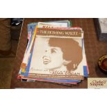 Approximately 60 pieces of illustrated sheet music