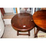 An oak circular topped table