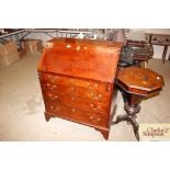 A mahogany oak bureau fitted four long drawers