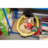 A plastic basket of various children's toys