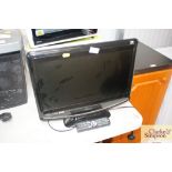 A Venturer flat screen television with remote cont