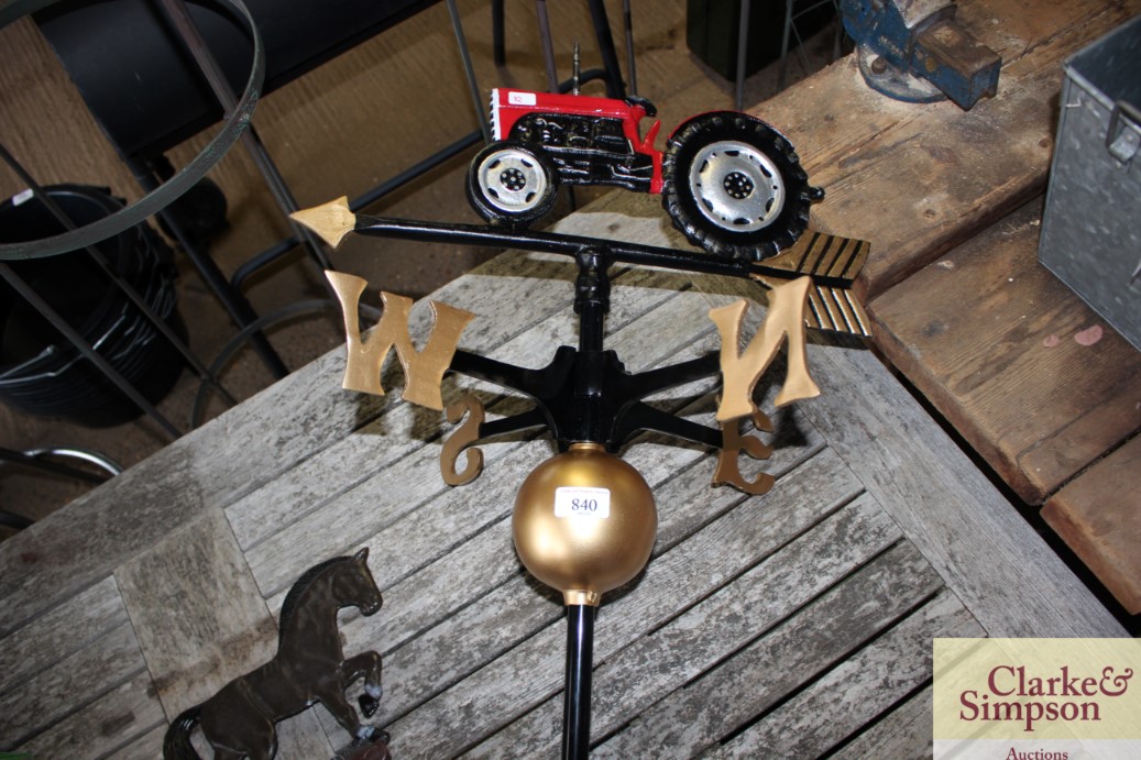 A weather vane decorated with a tractor (82)