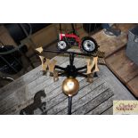 A weather vane decorated with a tractor (82)