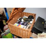 A wicker picnic hamper and contents of various CD'