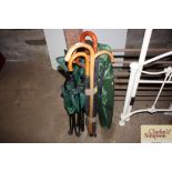Two camping chairs and a bundle or walking sticks