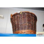 A wicker log basket and one other