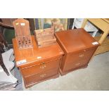 A pair of mahogany bedside chests fitted two drawe