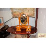 A pine dressing table mirror fitted two drawers