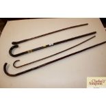 Four various walking sticks and canes