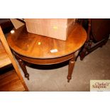 A circular mahogany coffee table