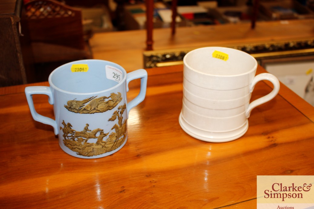A Victorian two handled mug; and a creamware mug